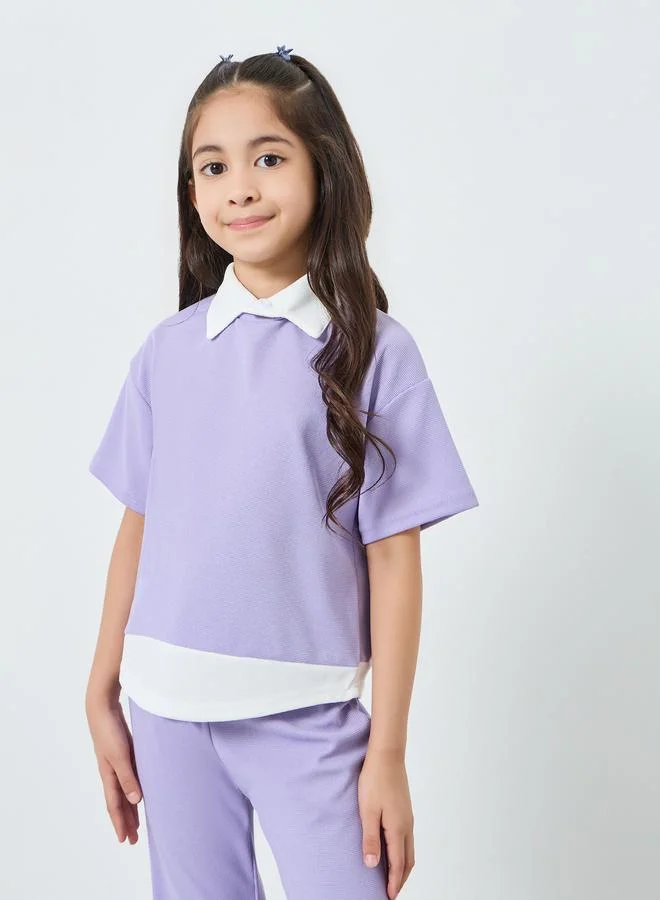 ستايلي مجموعة من بنطال وبلوزة بتفاصيل محبوكة